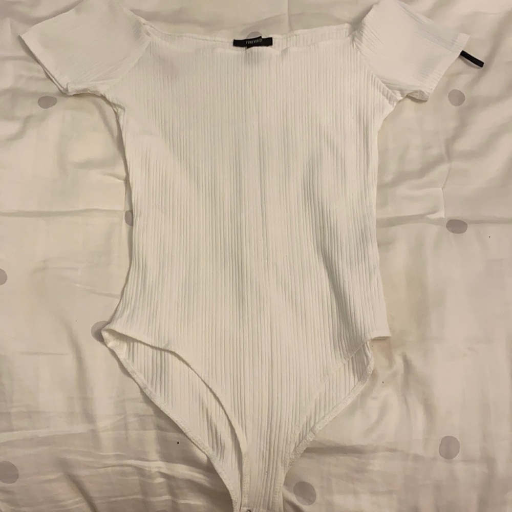 Slight of the shoulder body suit